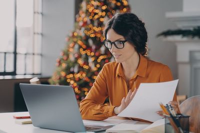 Young woman using laptop at home