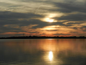 Scenic view of lake against sky during sunset