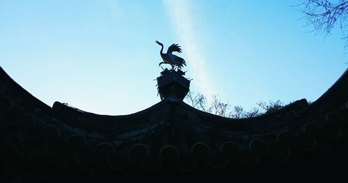 Low angle view of building against blue sky