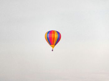 Low angle view of hot air balloons against clear sky