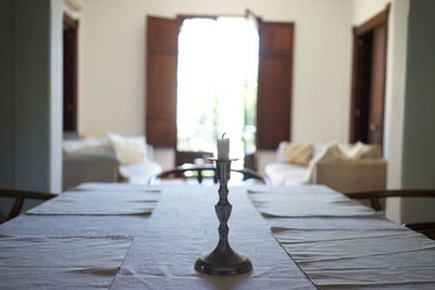 Close-up of candle on table at home