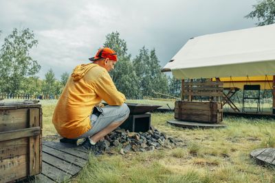 Rear view of man working at farm