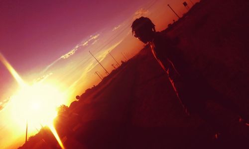 Man against sky during sunset