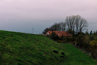 House on field against sky