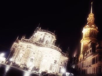 Low angle view of illuminated cathedral against sky at night