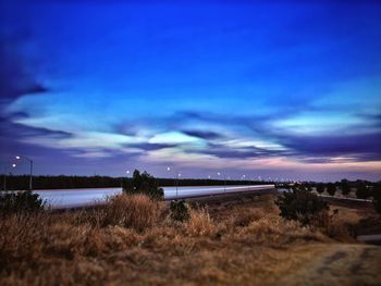 Scenic view of beach against sky during sunset