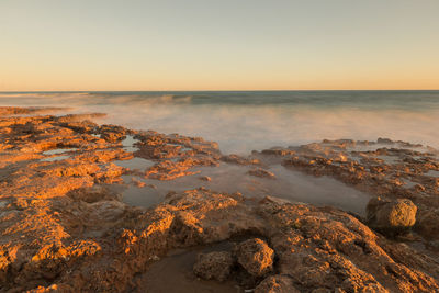 Scenic view of sea against clear sky