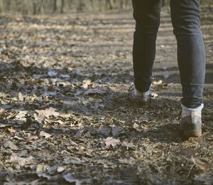 Low section of man standing on ground