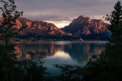 Scenic view of lake against sky during sunset