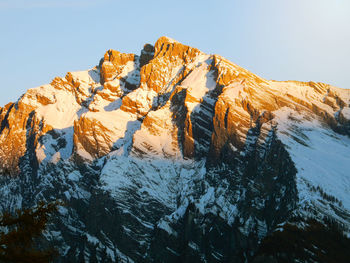 Scenic view of snowcapped mountain against sky