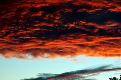 Low angle view of dramatic sky during sunset