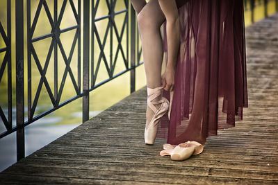 Low section of woman standing on steps