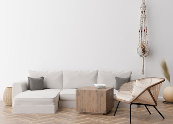 Empty white wall in modern living room. mock up interior in scandinavian, boho style