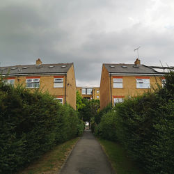 View of residential buildings against sky