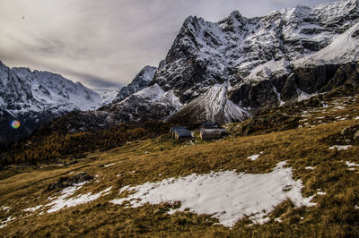 Scenic view of snowcapped mountains against sky