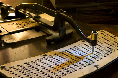 High angle view of old machine on table