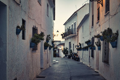 People walking on street in city in a white village of andalusia