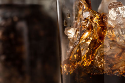 Close-up of coffee on glass table