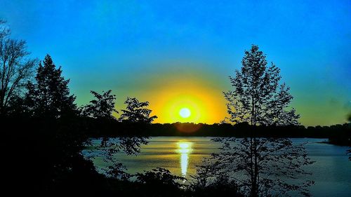 Scenic view of sunset over river