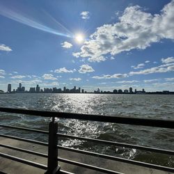 Scenic view of sea against sky on sunny day