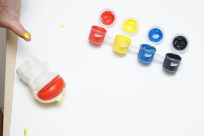 High angle view of multi colored toy on white background