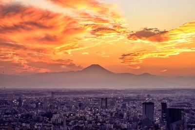 Aerial view of cityscape during sunset