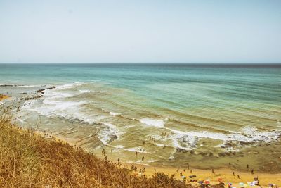 Scenic view of beach against clear sky