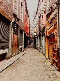 Narrow street leading towards buildings