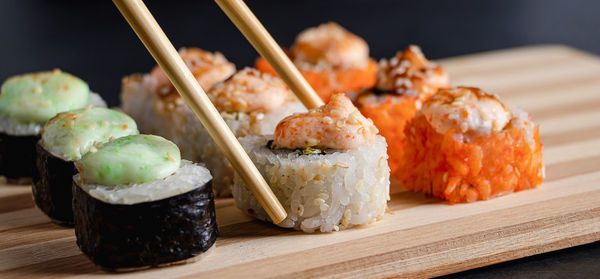 Close-up of sushi on cutting board