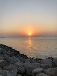 Scenic view of sea against sky during sunset