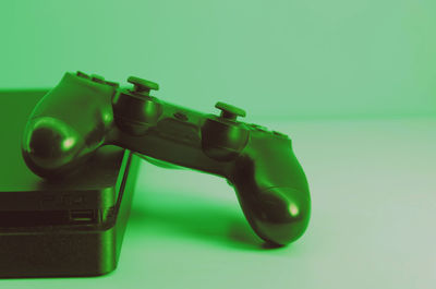 High angle view of toy on table against green background