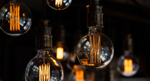 Close-up of illuminated light bulb in retro style