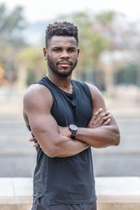 Young man exercising at beach