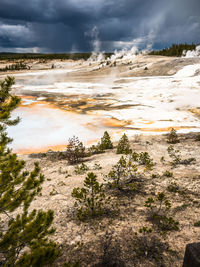 View of landscape against cloudy sky