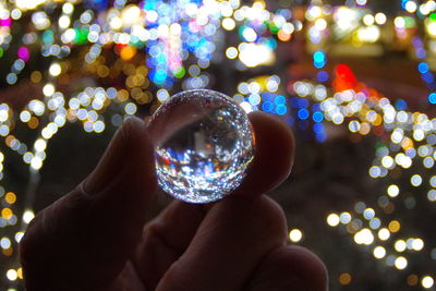 Cropped image of hand holding sparkler