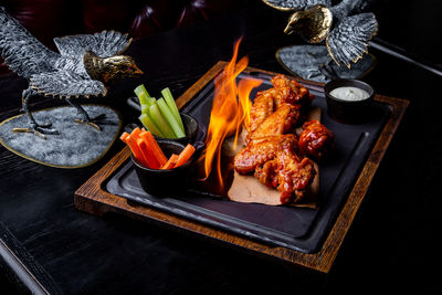 High angle view of meat on barbecue grill