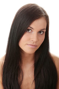 Close-up portrait of a smiling young woman over white background