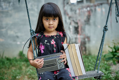 Portrait of cute girl standing outdoors