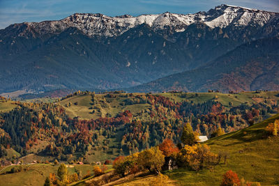 Scenic view of snowcapped mountains during autumn