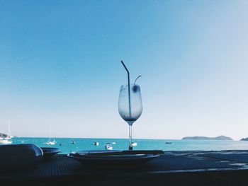 Scenic view of sea against clear blue sky