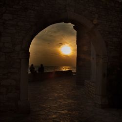 Silhouette of building at sunset