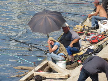 People sitting on boat in sea