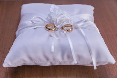 High angle view of wedding rings on table