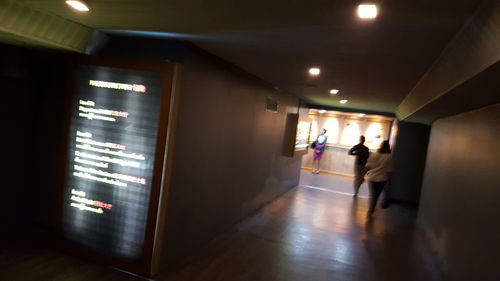 Rear view of man walking in underground walkway