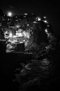 High angle view of illuminated buildings in city at night