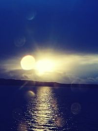 Scenic view of river against sky at sunset