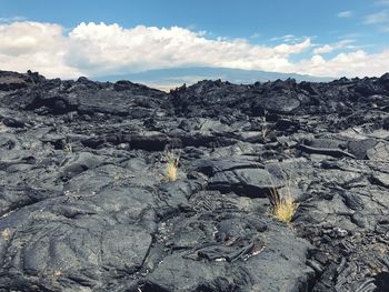 View of volcanic landscape against sky