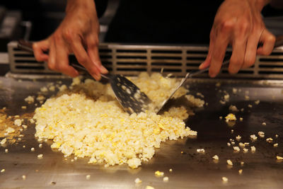 Close-up of person preparing food