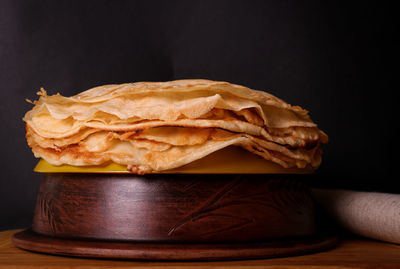 Close-up of pancakes against black background