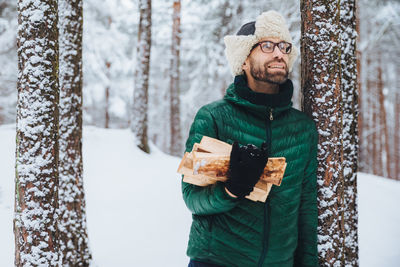 Full length of a man standing in forest